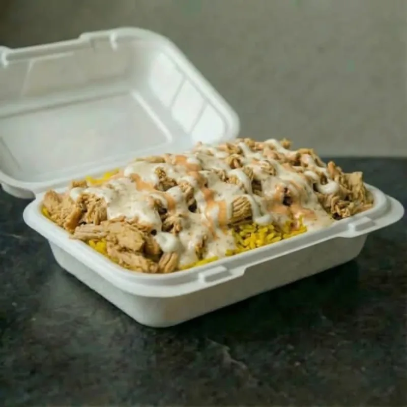 Chicken and rice bowl with vegetables and sauce